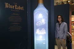 Artist Alvin Tan with his 3D artwork at the launch of the JOHNNIE WALKER Blue Label Gallery in Singapore Changi Airport